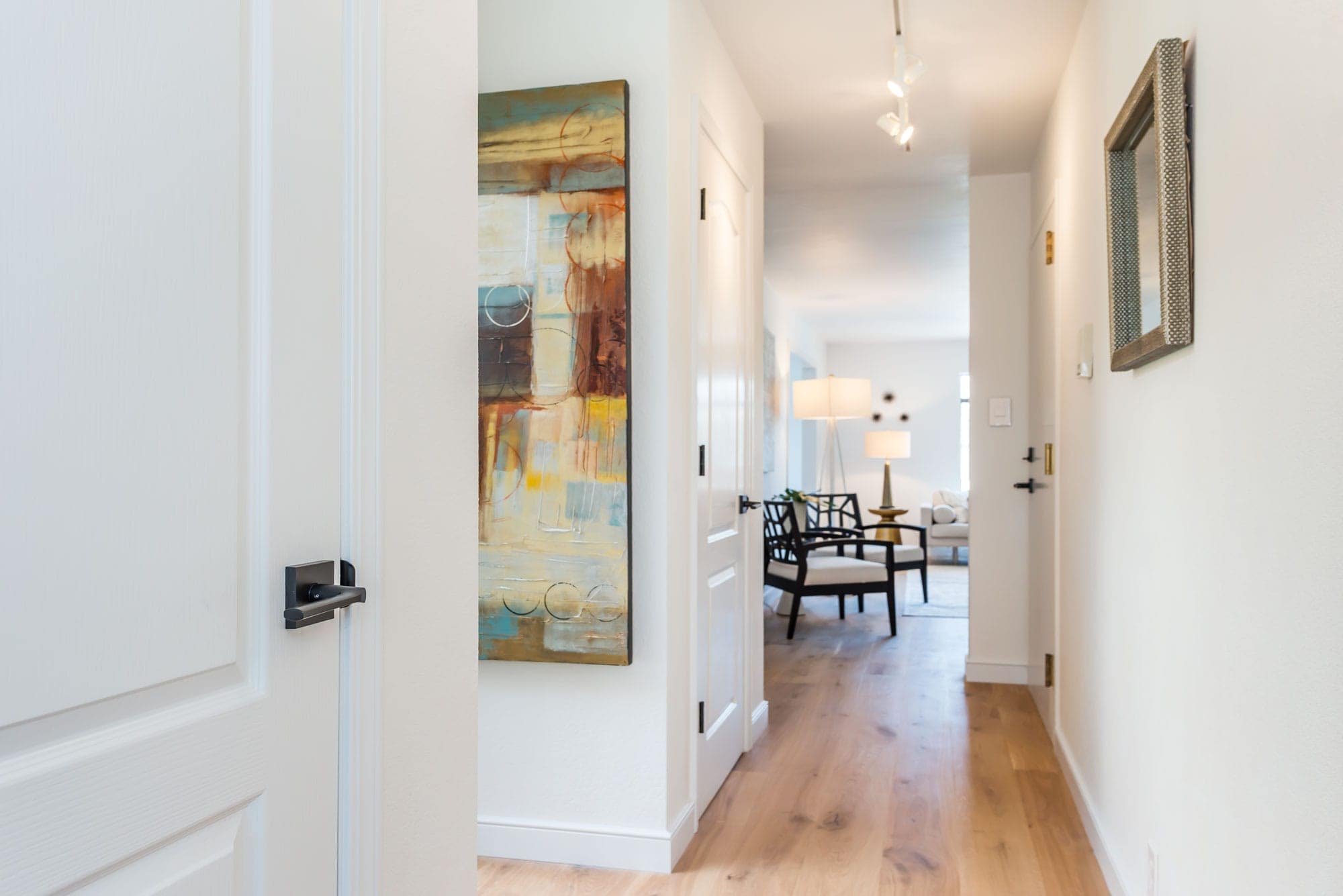 375 15th Avenue's updated hallway has two closets, new track lighting, those quiet hardwood floors we told you about and access to its deeded private center patio.