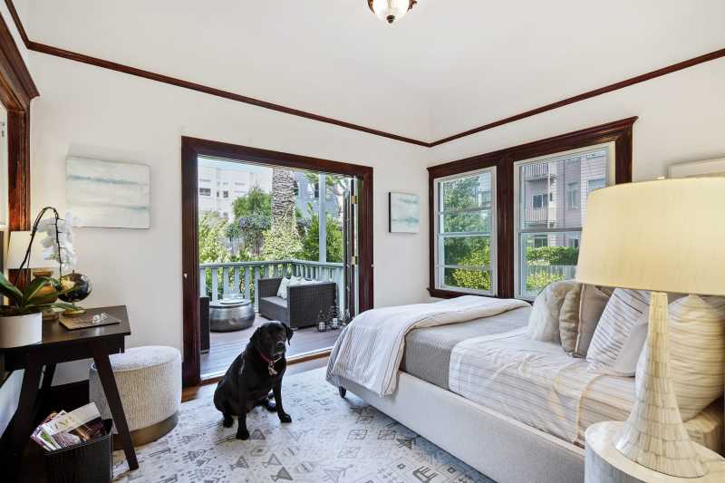 Mr. Raffi soaks in the sun in Unit 5's bedroom that opens out to its exclusive patio.