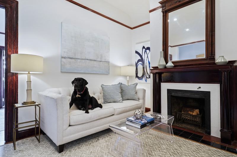 Mr Raffi, the living room and the fire place (which is usable to a limited extent). There's a marble tile mosaic surround, coved ceilings and recessed lighting.