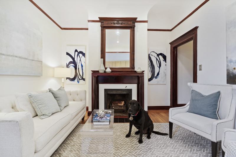 Mr Raffi, the living room and the fire place (which is usable to a limited extent). There's a marble tile mosaic surround, coved ceilings and recessed lighting.