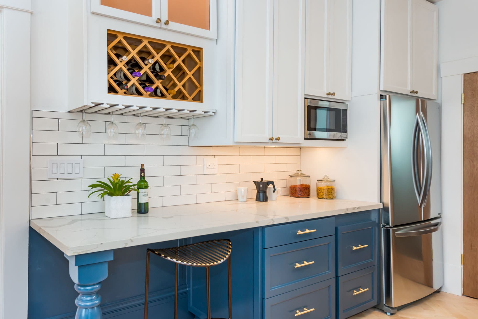 Enjoy a glass of wine from a bottle from 714 Page's updated kitchen the is as functional as it is beautiful.