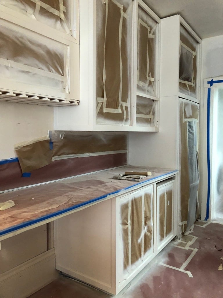 Instead of changing out the otherwise functional kitchen cabinets, we relied on Benjamin Moore and Kelly Moore's cabinet enamel paints to repaint them. Newburyport Blue and Decorators White were the the color choices.