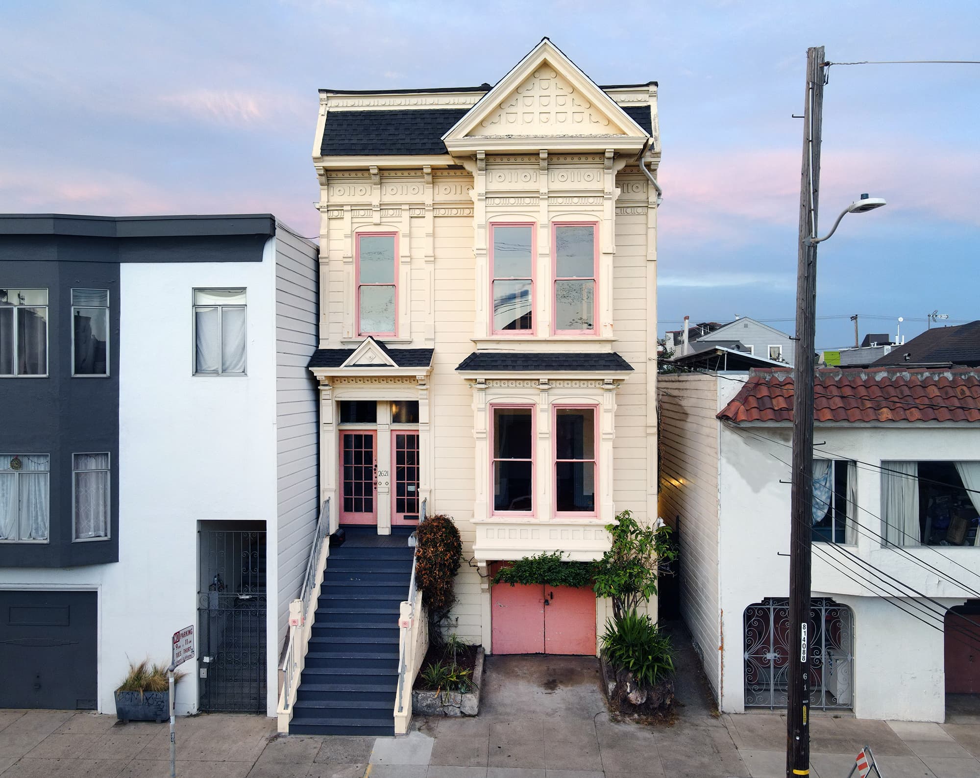 Just after magic hour, the front facade at 2621 Bryant