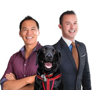 Photo of Kevin Ho, Jonathan McNarry and their black Labrador Retriever Raffi