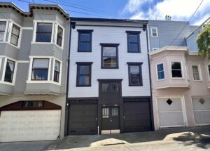 The Front facade dark base and gray painted siding