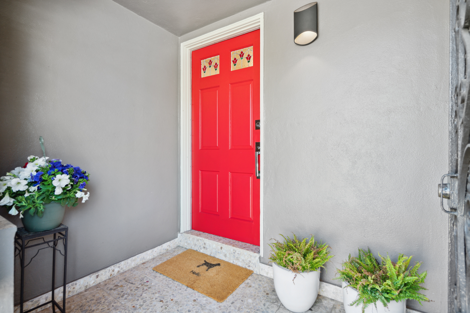 The red front door and plants