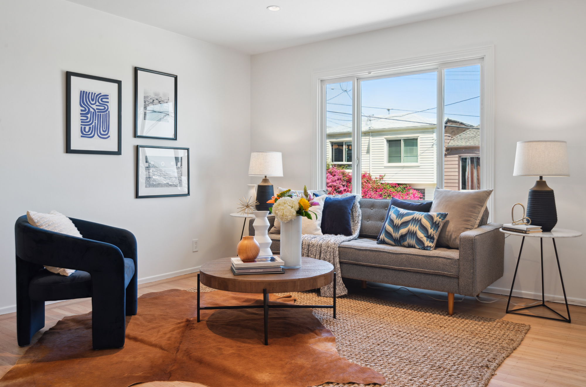 The living room with window and couch views out window