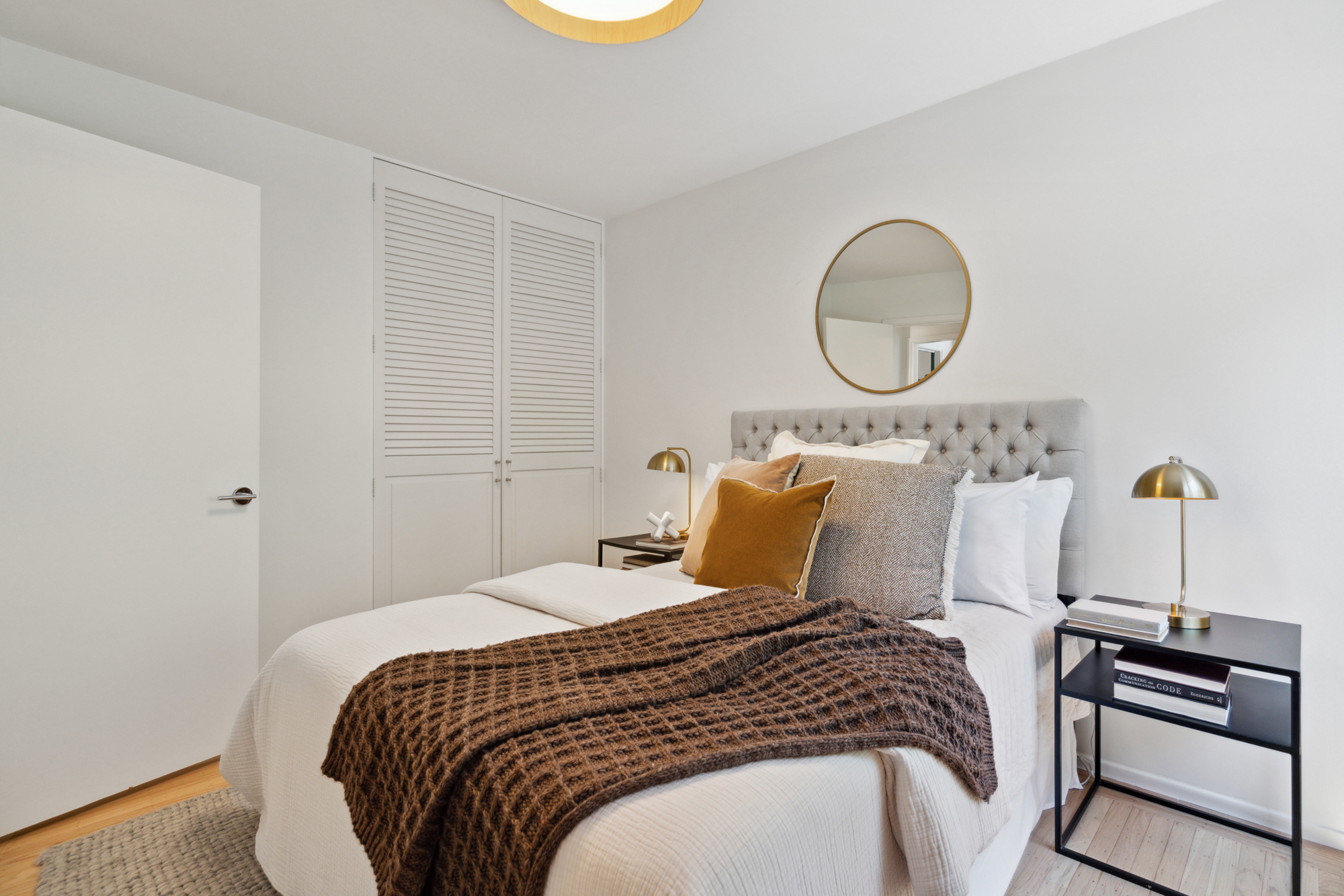 A queen sized bed with window to back garden and new LED light overhead