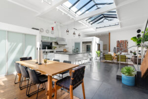 Image showcasing an interior space with an expansive skylight and modern design