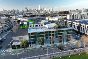 Aerial view of 88 Arkansas building with Unit 528 penthouse highlighted, set against the San Francisco skyline.