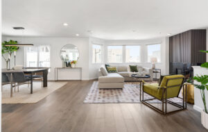 Bright open-concept living room with fireplace, wide-plank floors, and large windows at 36 Houston. SFAR MLS #425032188.